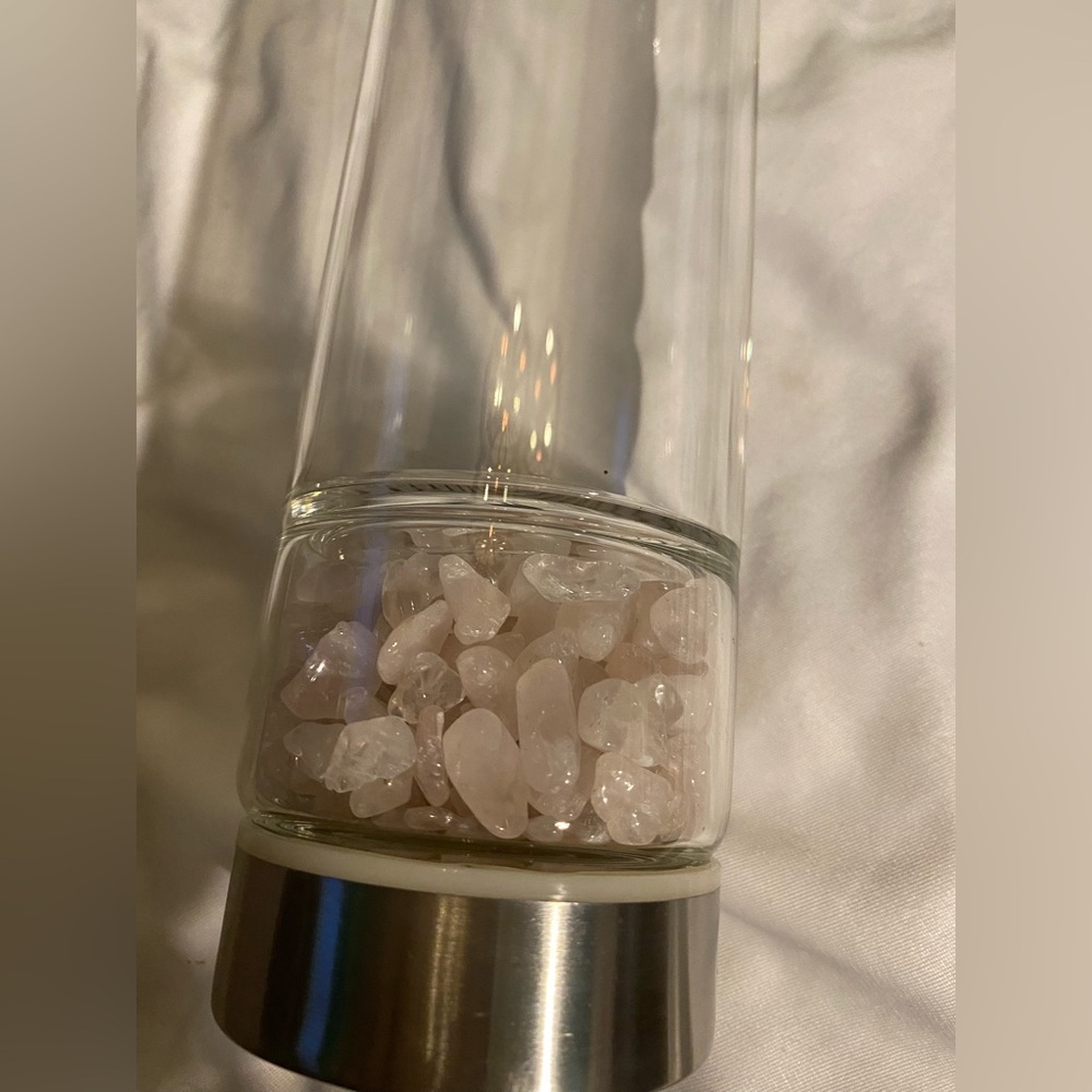 Clear Glass Water Bottle With Pink Crystals That Are Removable